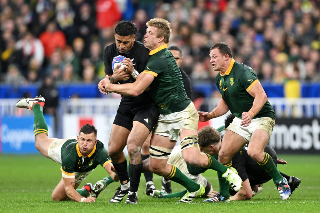 PARIS, FRANCE - OCTOBER 28: Rieko Ioane of New Zealand is tackled by Pieter-Steph Du Toit of South Africa during the Rugby World Cup Final match between New Zealand and South Africa at Stade de France on October 28, 2023 in Paris, France. (Photo by Mike Hewitt/Getty Images)