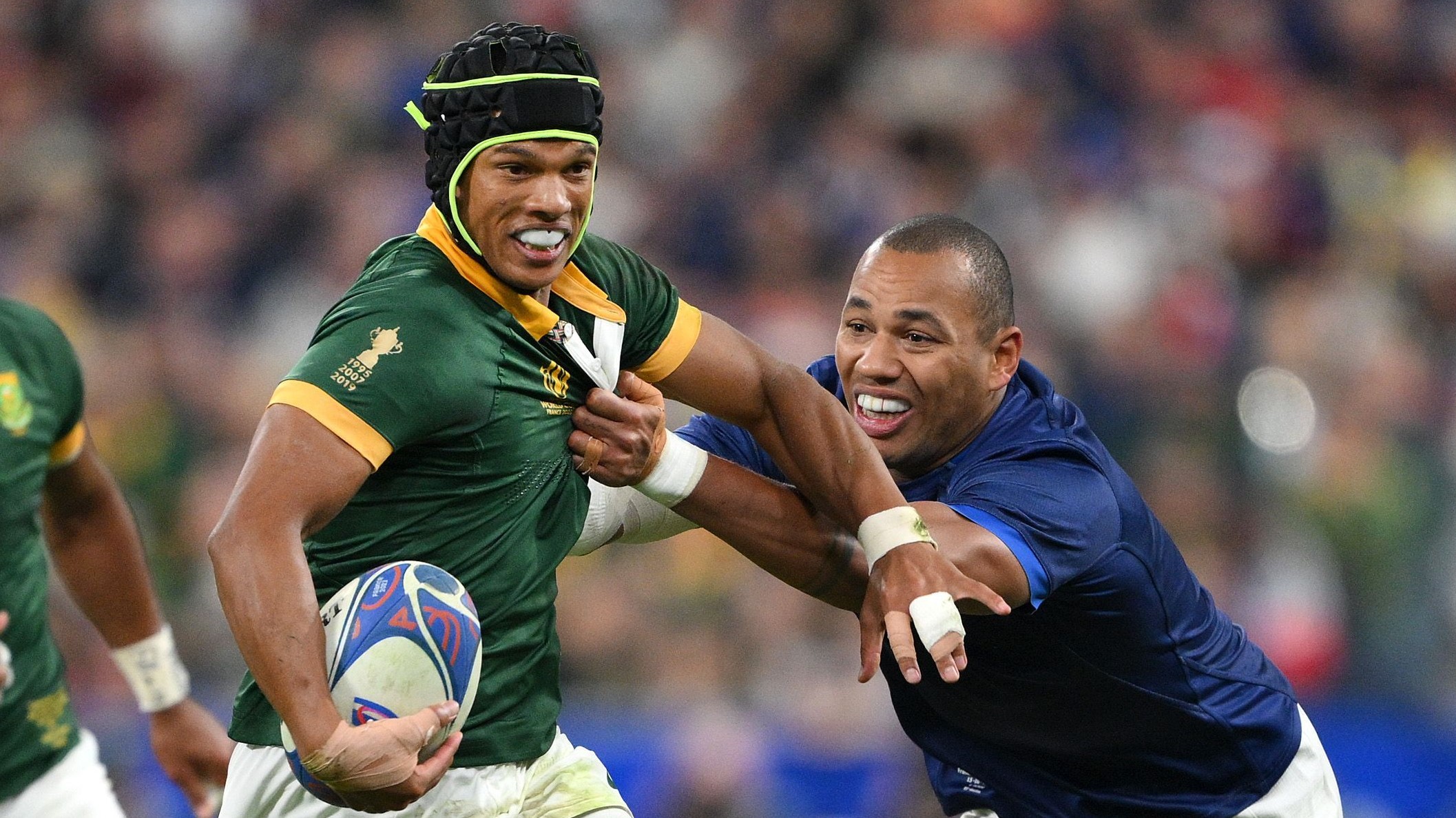 PARIS, FRANCE - OCTOBER 15: Kurt-Lee Arendse of South Africa is tackled by Gael Fickou of France during the Rugby World Cup France 2023 Quarter Final match between France and South Africa at Stade de France on October 15, 2023 in Paris, France. (Photo by David Ramos - World Rugby/World Rugby via Getty Images)