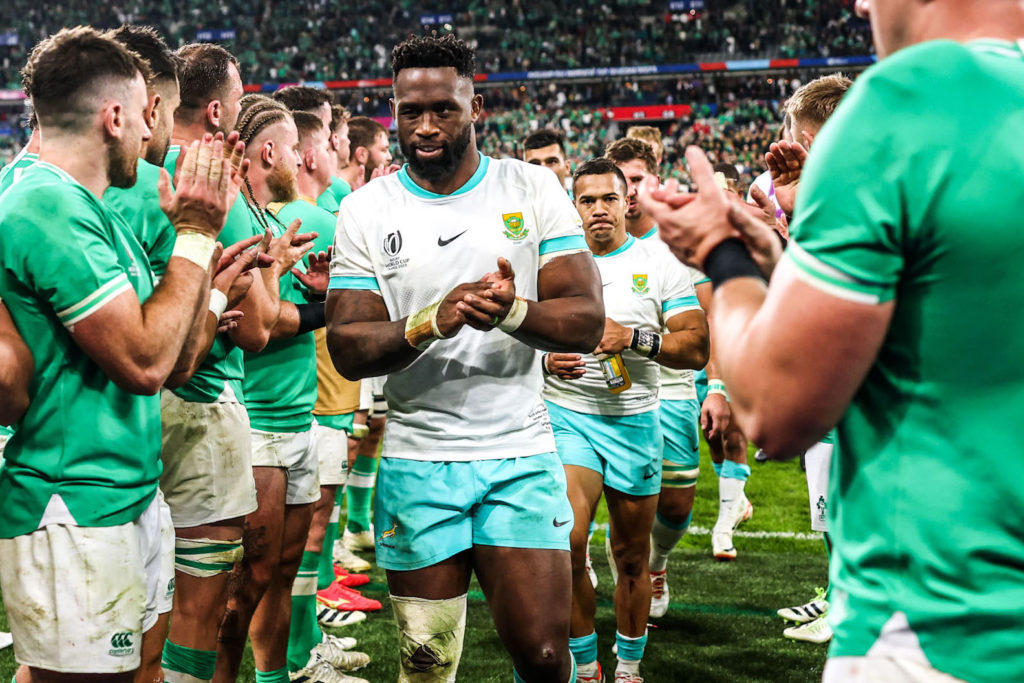 Siya Kolisi leads the Springboks off the pitch after losing to Ireland at France 2023