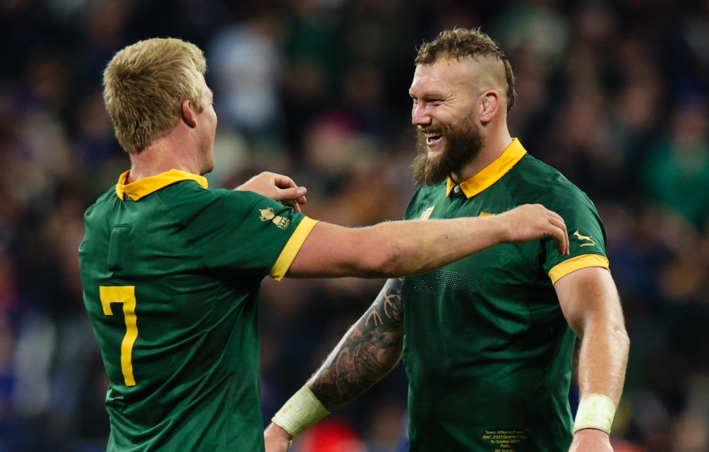 PARIS, FRANCE - OCTOBER 15: Pieter-Steph du Toit of South Africa celebrates with team mate RG Snyman after their sides victory at the final whistle during the Rugby World Cup France 2023 Quarter Final match between France and South Africa at Stade de France on October 15, 2023 in Paris, France.