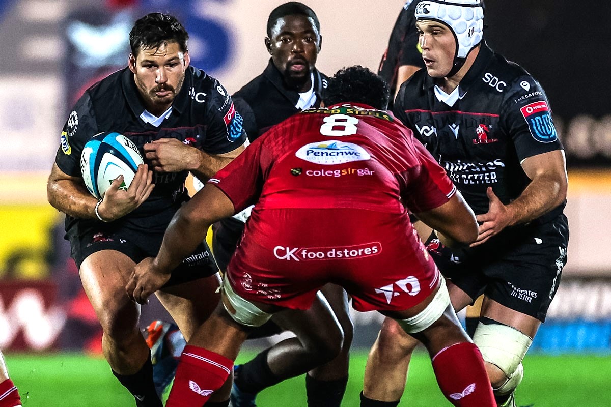 Marius Louw, Sanele Nohamba and Henco van Wyk in action for the Lions against Scarlets