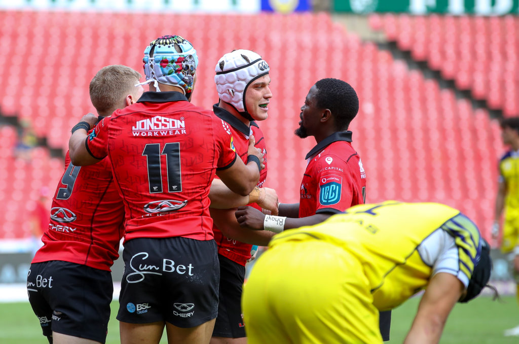 JOHANNESBURG, SOUTH AFRICA - NOVEMBER 25: Henco van Wyk of the Emirates Lions congratulated after scoring his try during the United Rugby Championship match between Emirates Lions and Zebre at Emirates Airline Park on November 25, 2023 in Johannesburg, South Africa. (Photo by Gordon Arons/Gallo Images)