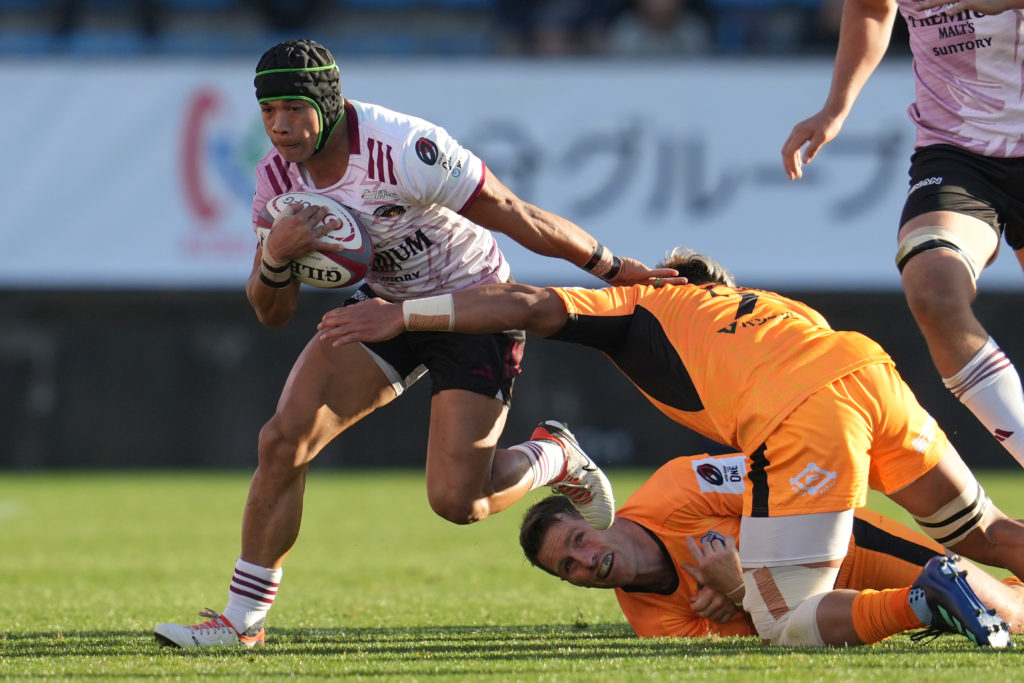 TOKYO, JAPAN - DECEMBER 10: Cheslin Kolbe of Tokyo Suntory Sungoliath is tackled by Takeo Suenaga (R) and Bernard Foley (bottom) of Kubota Spears Funabashi Tokyo Bay during the NTT Japan Rugby League One match between Kubota Spears Funabashi Tokyo Bay and Tokyo Suntory Sungoliath at Prince Chichibu Memorial Ground on December 10, 2023 in Tokyo, Japan.