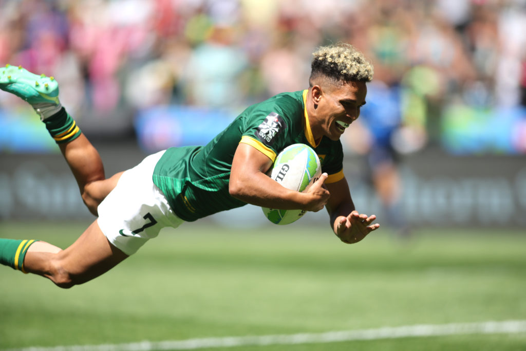 CAPE TOWN, SOUTH AFRICA - DECEMBER 09: Ronald Brown of South Africa dives over to score a try during day 1 of the HSBC SVNS Cape Town at DHL Stadium on December 09, 2023 in Cape Town, South Africa.