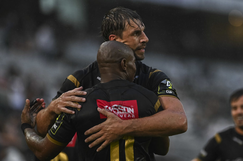 DURBAN, SOUTH AFRICA - DECEMBER 09: Makazole Mapimpi of the Hollywoodbets Sharks congratulated by Eben Etzebeth of the Hollywoodbets Sharks during the EPCR Challenge Cup match between Hollywoodbets Sharks and Section Paloise at Hollywoodbets Kings Park Stadium on December 09, 2023 in Durban, South Africa. (Photo by Steve Haag Sports/Gallo Images)