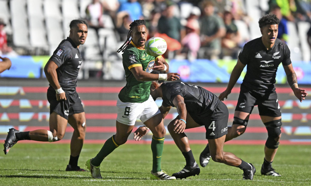South AFrica captain Selvyn Davids gets his pass away as he is challenged by Akuila Rokolisoa of New Zealand during day two of the 2023 HSBC Cape Town Sevens at Cape Town Stadium on 10 December 2023 ©Ryan Wilkisky/BackpagePix