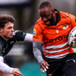 AMSTERDAM, NETHERLANDS - JANUARY 14: Tapiwa Mafura of Toyota Cheetahs is tackled by Thomas Carol of Section Paloise during the EPCR Challenge Cup match between Toyota Cheetahs and Section Paloise at NRCA Stadium on January 14, 2024 in Amsterdam, Netherlands. (Photo by Dean Mouhtaropoulos/Getty Images)