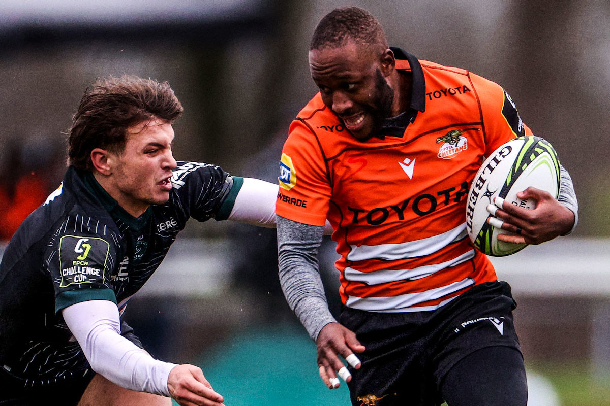 AMSTERDAM, NETHERLANDS - JANUARY 14: Tapiwa Mafura of Toyota Cheetahs is tackled by Thomas Carol of Section Paloise during the EPCR Challenge Cup match between Toyota Cheetahs and Section Paloise at NRCA Stadium on January 14, 2024 in Amsterdam, Netherlands. (Photo by Dean Mouhtaropoulos/Getty Images)