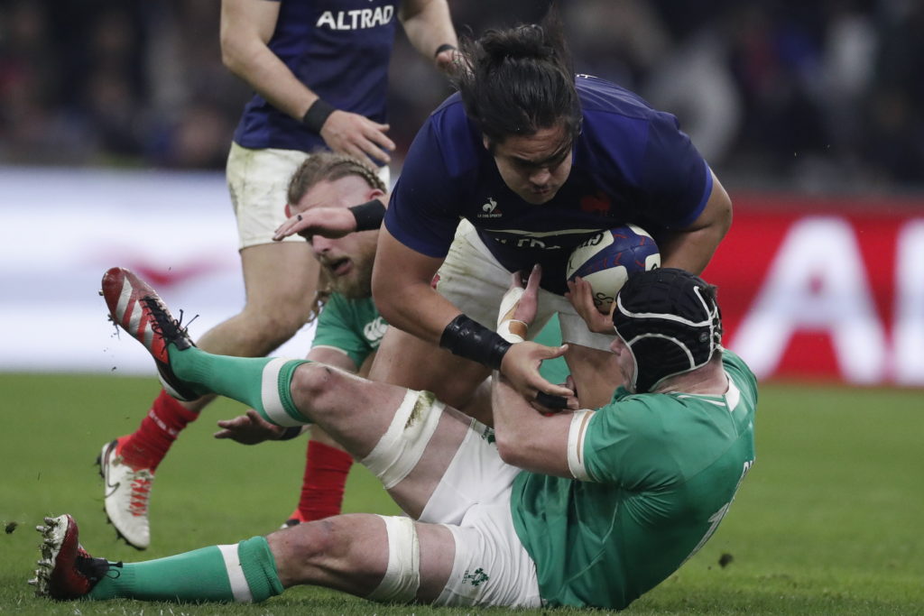 epa11121998 Posolo Tuilagi (C) of France in action against James Ryan (R-down) of Ireland during the Six Nations rugby match between France and Ireland at Stade Velodrome in Marseille, southern France, 02 February 2024. EPA/Guillaume Horcajuelo