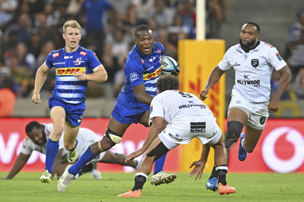 Hacjivah Dayimani of the Stormers runs at Jaden Hendrikse of the Sharks during the 2023 United Rugby Championship game between the Stormers and Sharks at Cape Town Stadium on 30 December 2023 ©Ryan Wilkisky/BackpagePix