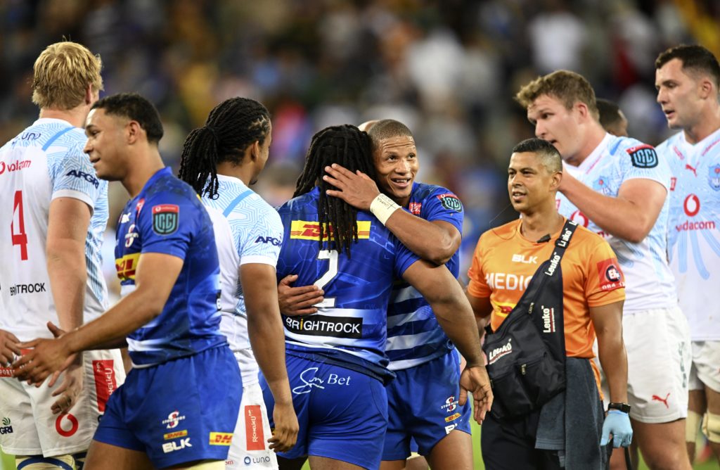 Manie Libbok of the Stormers celebrates with teammate Joseph Dweba of the Stormers after the 2023 United Rugby Championship game between the Stormers and Bulls at Cape Town Stadium on 23 December 2023 ©Ryan Wilkisky/BackpagePix