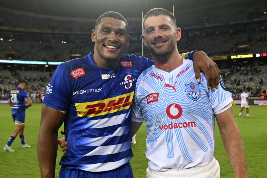 Springbok teammates Damian Willemse of the Stormers and Willie le Roux of the Bulls embrace after the 2023 United Rugby Championship game between the Stormers and Bulls at Cape Town Stadium on 23 December 2023 ©Ryan Wilkisky/BackpagePix