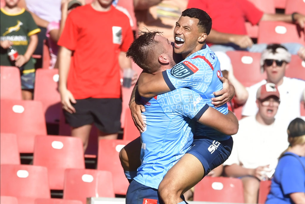 JOHANNESBURG, SOUTH AFRICA - FEBRUARY 17: David Kriel of the Bulls scores a try and celebrate with his teammates during the United Rugby Championship match between Emirates Lions and Vodacom Bulls at Emirates Airline Park on February 17, 2024 in Johannesburg, South Africa. (Photo by Sydney Seshibedi/Gallo Images)