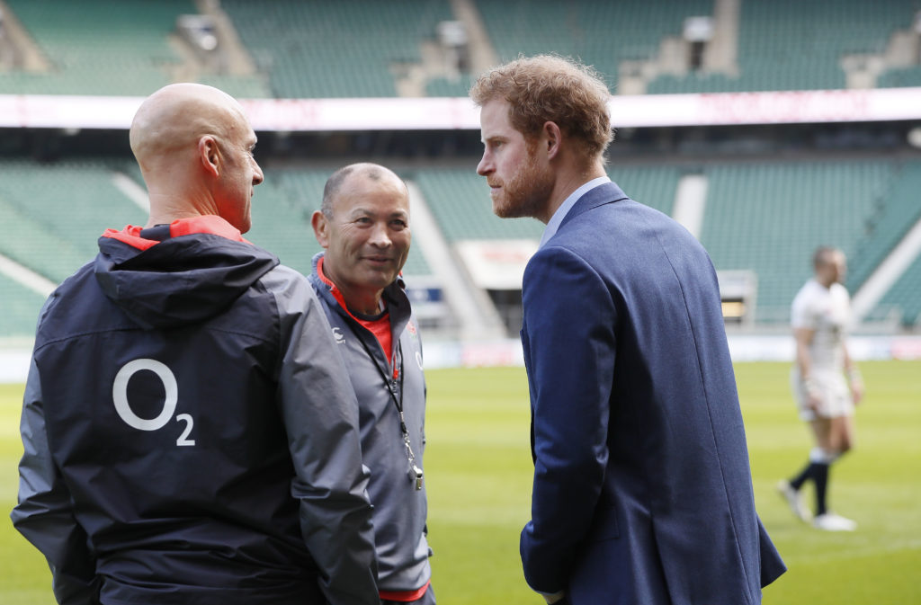 LONDON, ENGLAND - FEBRUARY 17: Britain's Prince Harry, (R) speaks with England Coach Eddie Jones, (C) during a visit to an England Rugby Squad training session at Twickenham Stadium on February 17, 2017 in London, England. In his new role as Patron of the Rugby Football Union (RFU), Prince Harry attended the England rugby team open training session. (Photo by Kirsty Wigglesworth - WPA Pool/Getty Images)