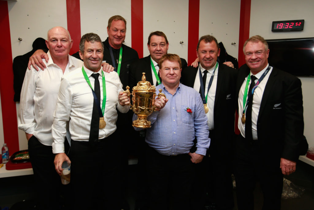 LONDON, ENGLAND - OCTOBER 31: (L-R) All Black coaching staff Mike Cron, Wayne Smith, Mick Byrne, Steve Hasen, Aussie McLean, Ian Foster and Grant Fox pose with the Webb Ellis Cup following the 2015 Rugby World Cup Final match between New Zealand and Australia at Twickenham Stadium on October 31, 2015 in London, United Kingdom. (Photo by Phil Walter/Getty Images)