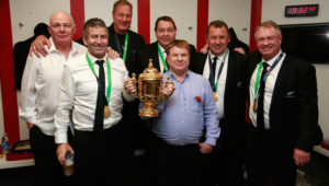 LONDON, ENGLAND - OCTOBER 31: (L-R) All Black coaching staff Mike Cron, Wayne Smith, Mick Byrne, Steve Hasen, Aussie McLean, Ian Foster and Grant Fox pose with the Webb Ellis Cup following the 2015 Rugby World Cup Final match between New Zealand and Australia at Twickenham Stadium on October 31, 2015 in London, United Kingdom. (Photo by Phil Walter/Getty Images)