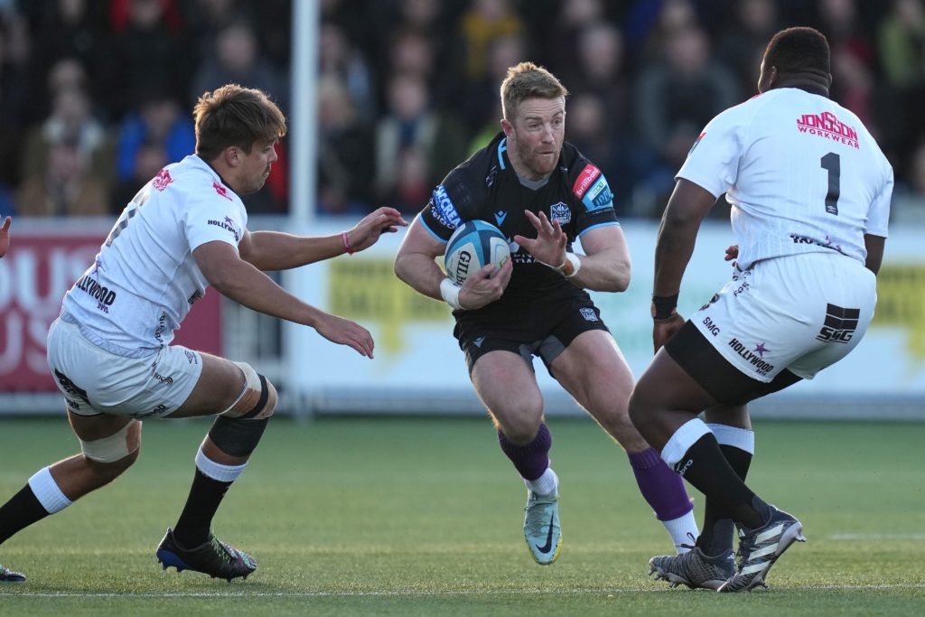 Mandatory Credit: Photo by Mark Runnacles/Shutterstock (14441431ah) Kyle Steyn of Glasgow Warrior's is challenged by Ntuthuko McHunu and Lappies Labuschagne of Sharks Glasgow Warriors v Sharks, United Rugby Championship, Rugby, Scotstoun Stadium, Glasgow, UK - 19 Apr 2024
