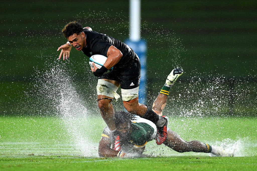SUNSHINE COAST, AUSTRALIA - MAY 02: Malachi Wrampling-Alec of New Zealand is tackled during The Rugby Championship U20 Round 1 match between New Zealand and South Africa at Sunshine Coast Stadium on May 02, 2024 in Sunshine Coast, Australia. (Photo by Albert Perez/Getty Images)